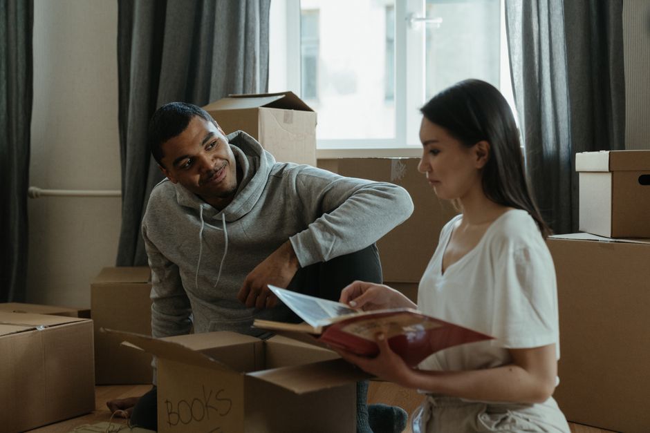 An older couple planning a move with a professional at home.